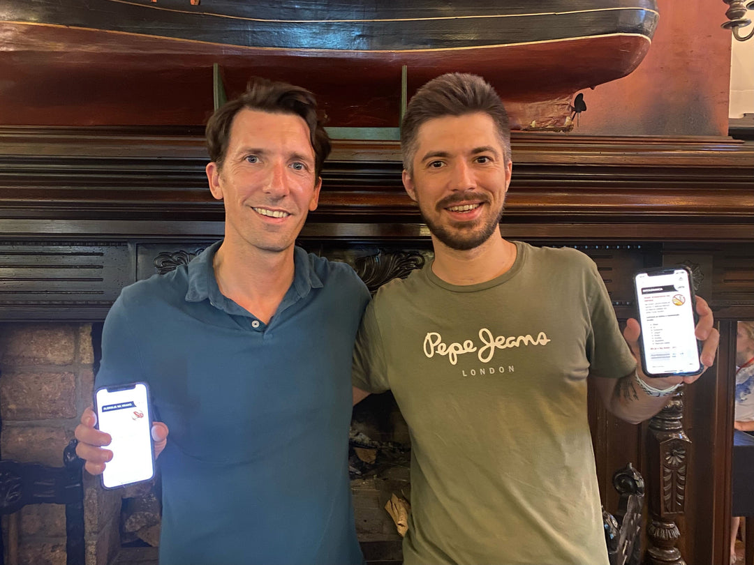 Kyle Dine, CEO and Anatolii Serebrianskii, CTO each showing the Equal Eats app for coeliac disease