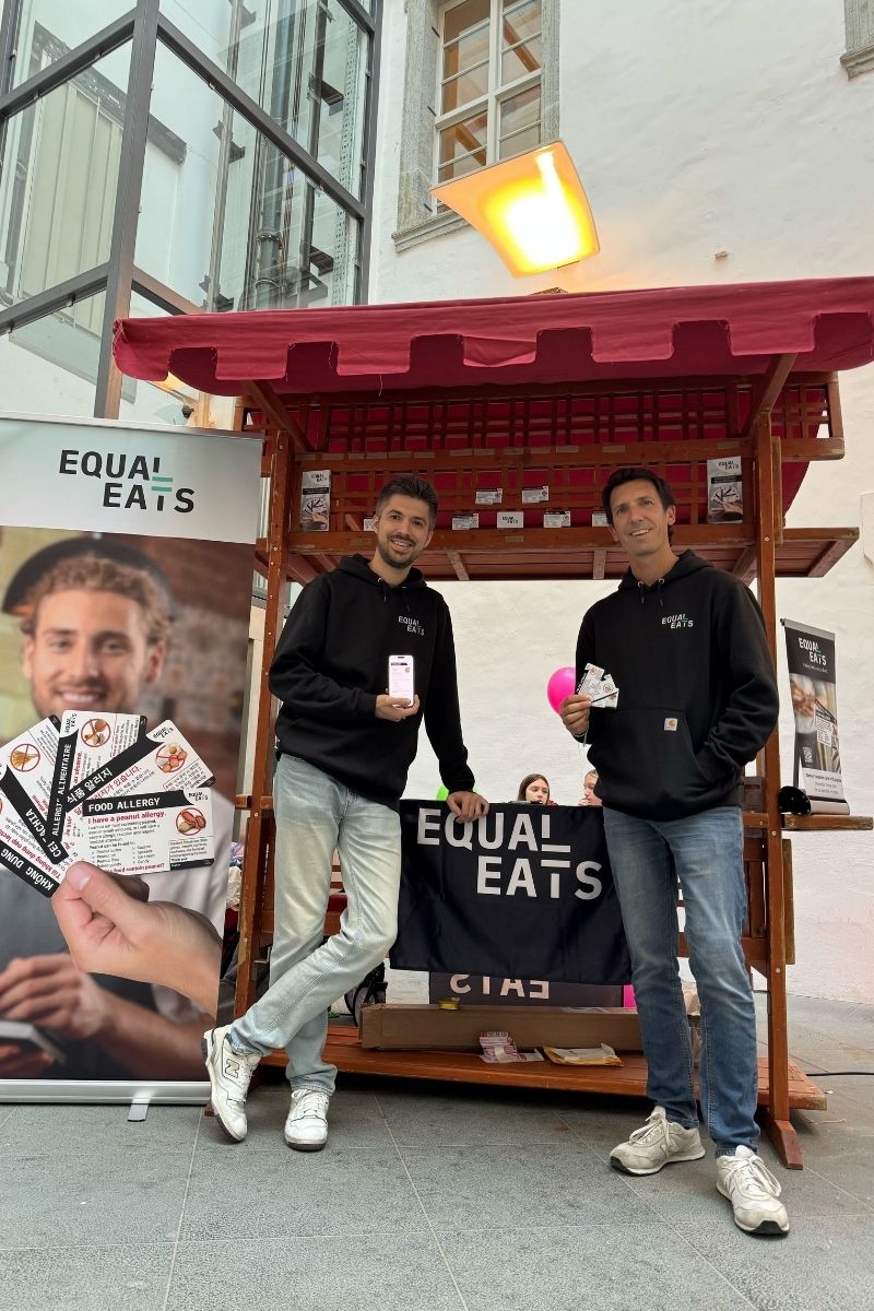 Anatolii and Kyle in front of the Equal Eats stand at Gluten-Free Expo Slovenia