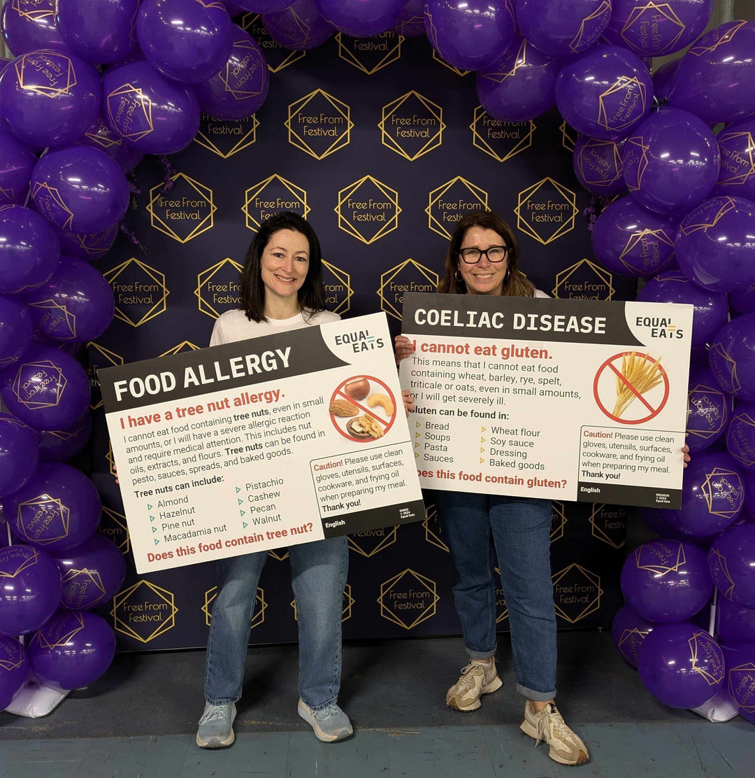 Lisa and Karina holding translation cards at Free From Festival Bristol 2025