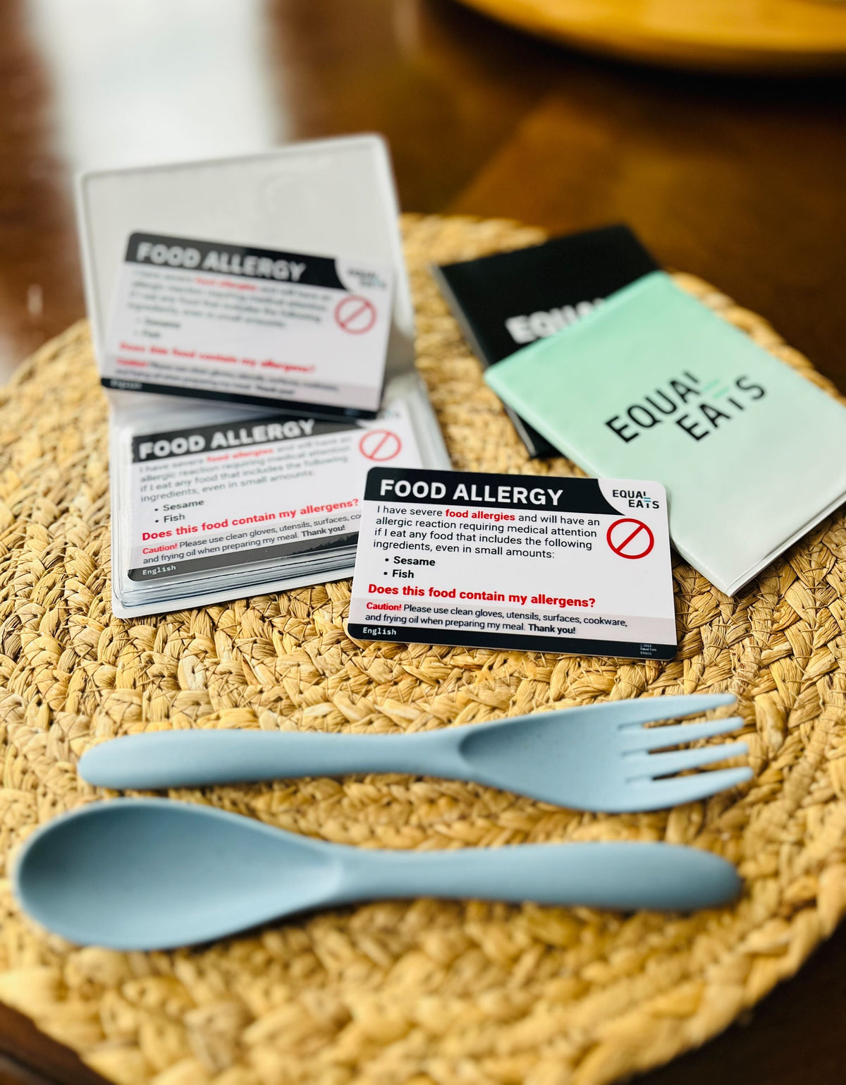 Equal Eats food allergy translation cards on a restaurant table